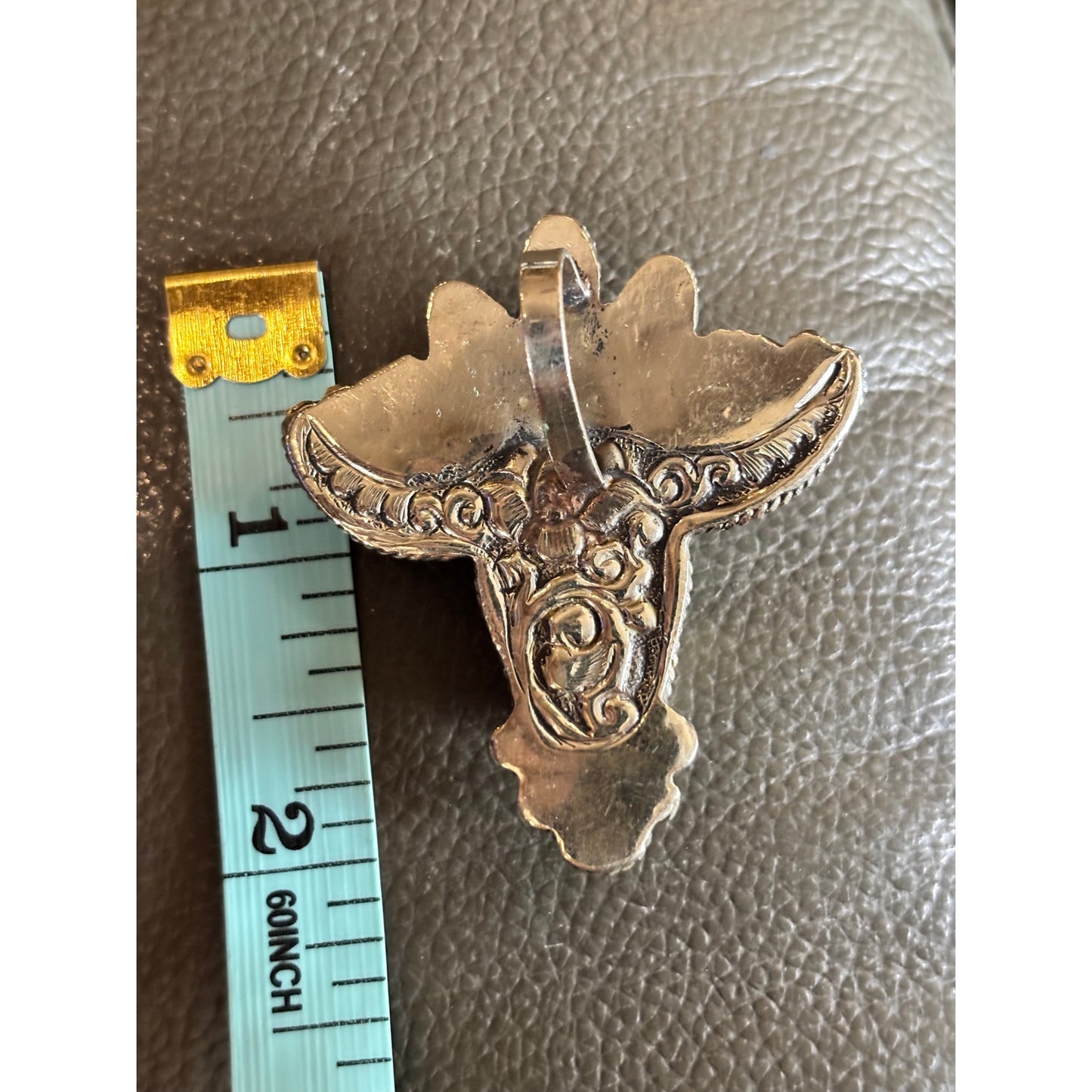 Such a cool Pendant. Steer Head in White Stone and a Turquoise accent.
